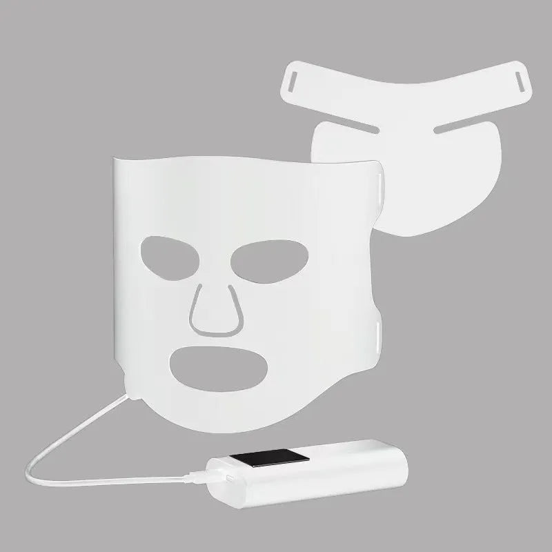 Black and gold LED phototherapy face mask with controller for home skin treatment.