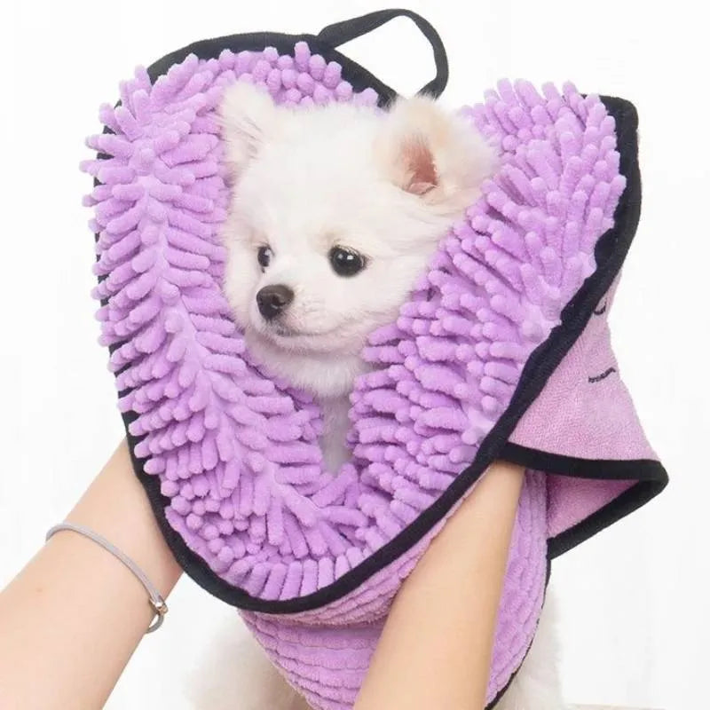 Blue pet bath robe towel for drying a dog after a wash, showing its size and soft texture.