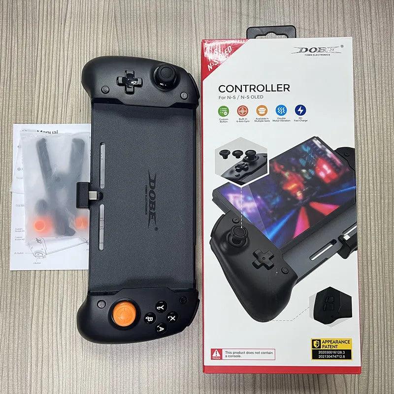 Black and white Nintendo Switch gamepad handle with console inserted, showing button layout and USB-C charging port
