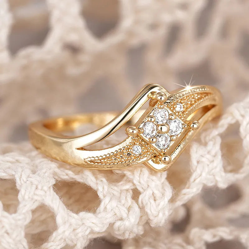 Women's copper diamond ring with micro inlaid zircon decoration in yellow gold colour showing geometric design
