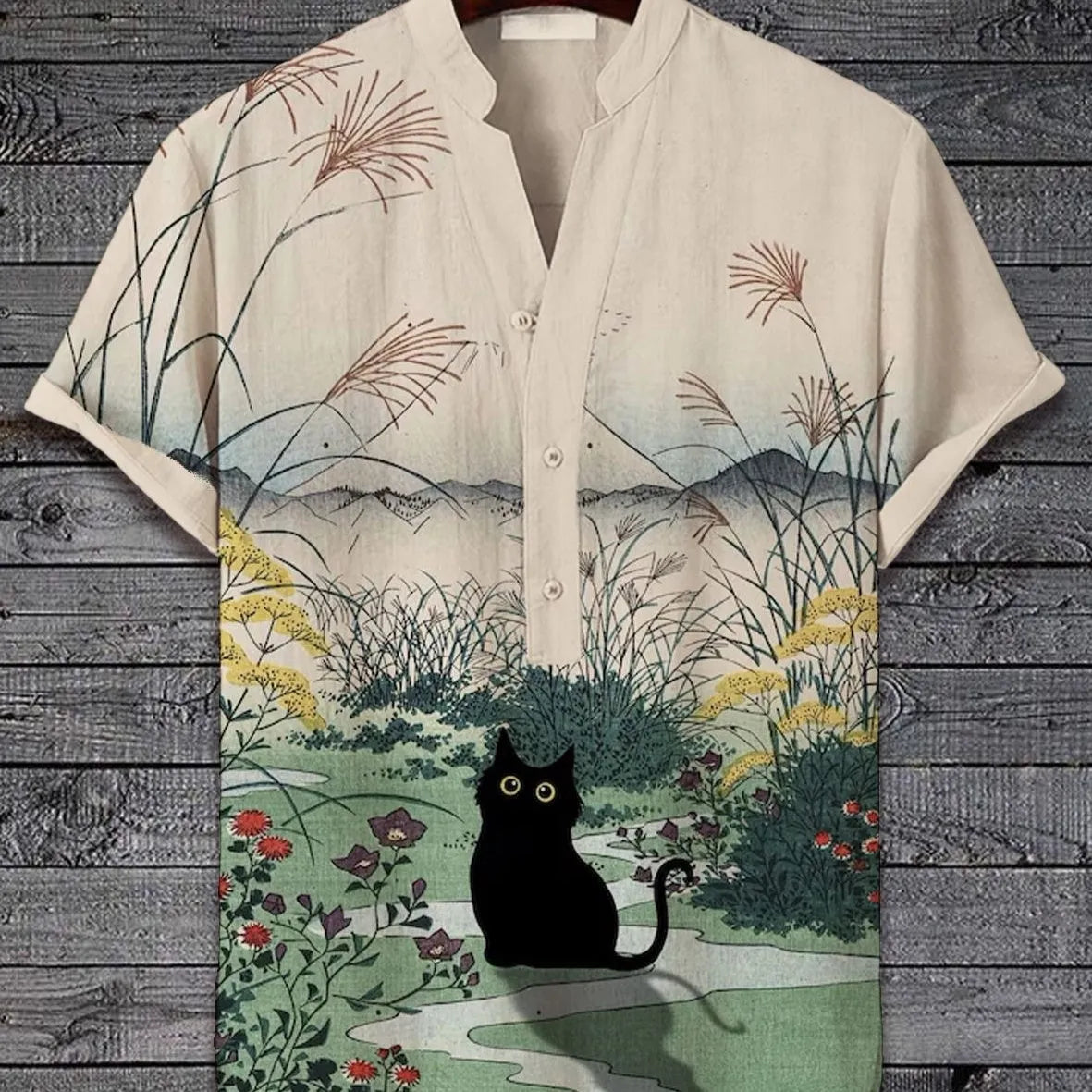 Man wearing a short sleeve shirt with a colourful 3D digital animal print design on the front.