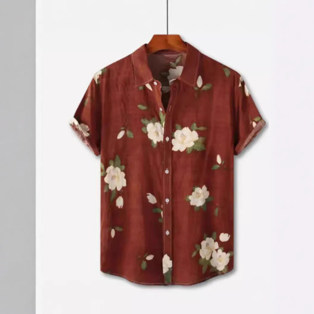 Man wearing a short sleeve lapel collar Hawaiian shirt with a blue floral print.