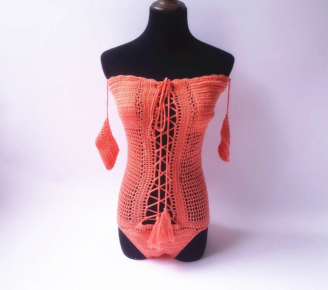 Women's off-shoulder one-piece swimsuit in light pink on a mannequin