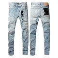 Black slim fit skinny jeans with straight leg, button fly, and manual distressing detail.