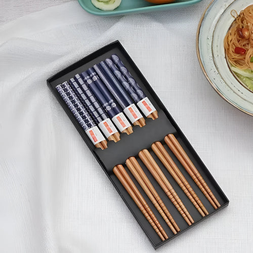 Set of five pairs of bamboo chopsticks with colourful Japanese lucky cat pattern design.
