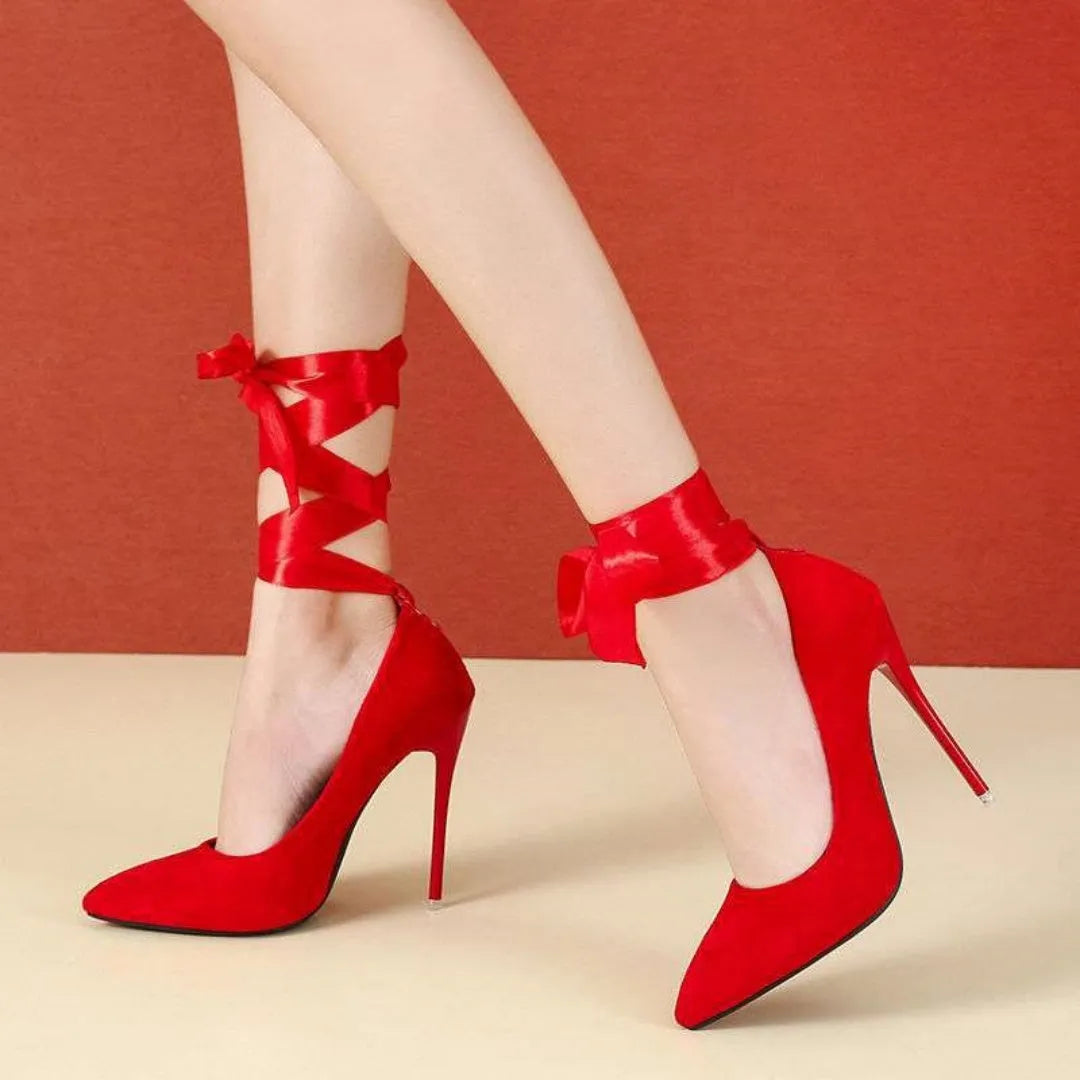 Women's black pointed toe high heel pump with a thin shallow mouth and a lace ankle strap