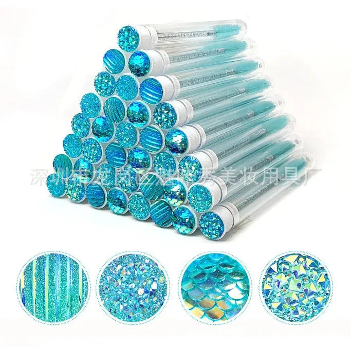 Disposable mascara brushes in protective transparent tubes with spiral brush heads in blue, green, pink, and purple colours