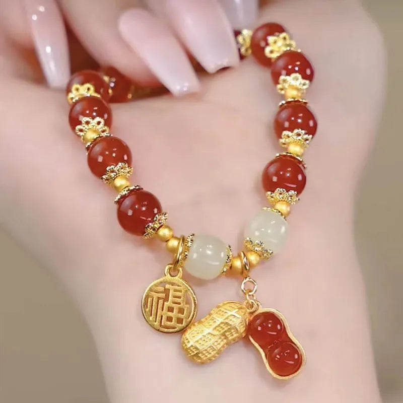 Handmade Chinese style glass bracelet with bamboo joint beads in a red Lvzhu Duobao design.