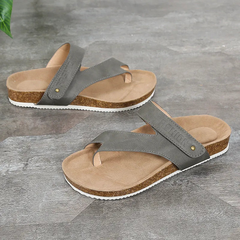 Women's flat toe ring flip-flop in a solid colour with a thick foam sole.