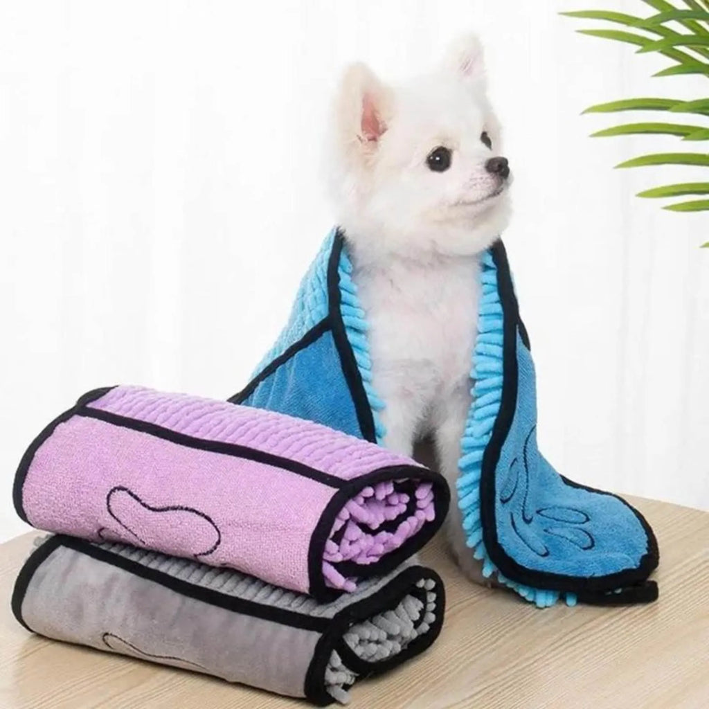Blue pet bath robe towel for drying a dog after a wash, showing its size and soft texture.