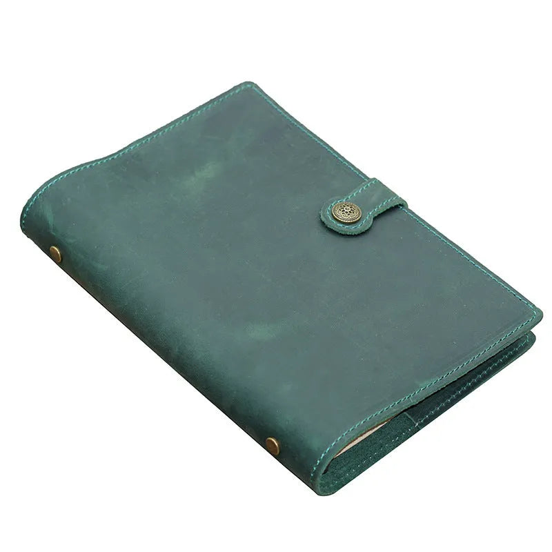 A5 handmade cowhide notebook with genuine leather cover in Crazy Horse Brown, opened on a table