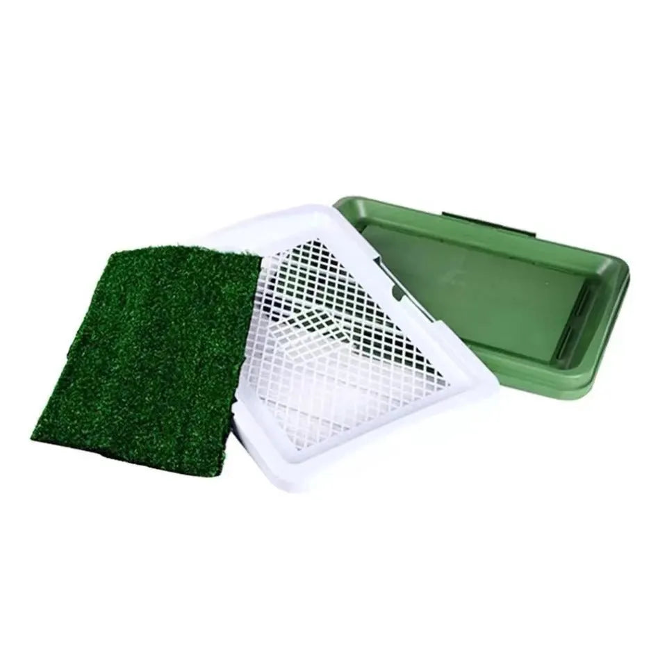 Green artificial grass dog toilet patch with plastic training tray and removable collection base.