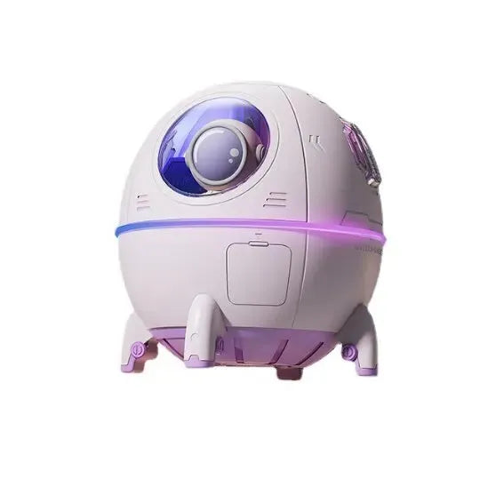 Light purple astronaut capsule-shaped portable USB humidifier on a desk