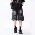 Men's loose-fit washed ripped denim shorts in black and blue colours with distressed detailing and retro styling