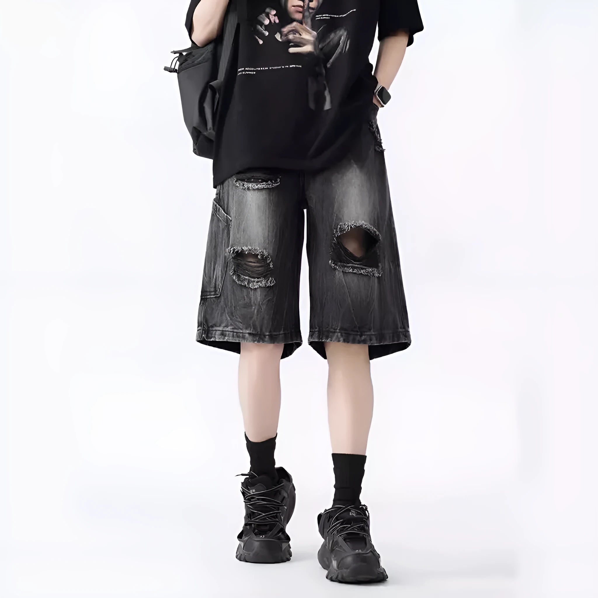 Men's loose-fit washed ripped denim shorts in black and blue colours with distressed detailing and retro styling
