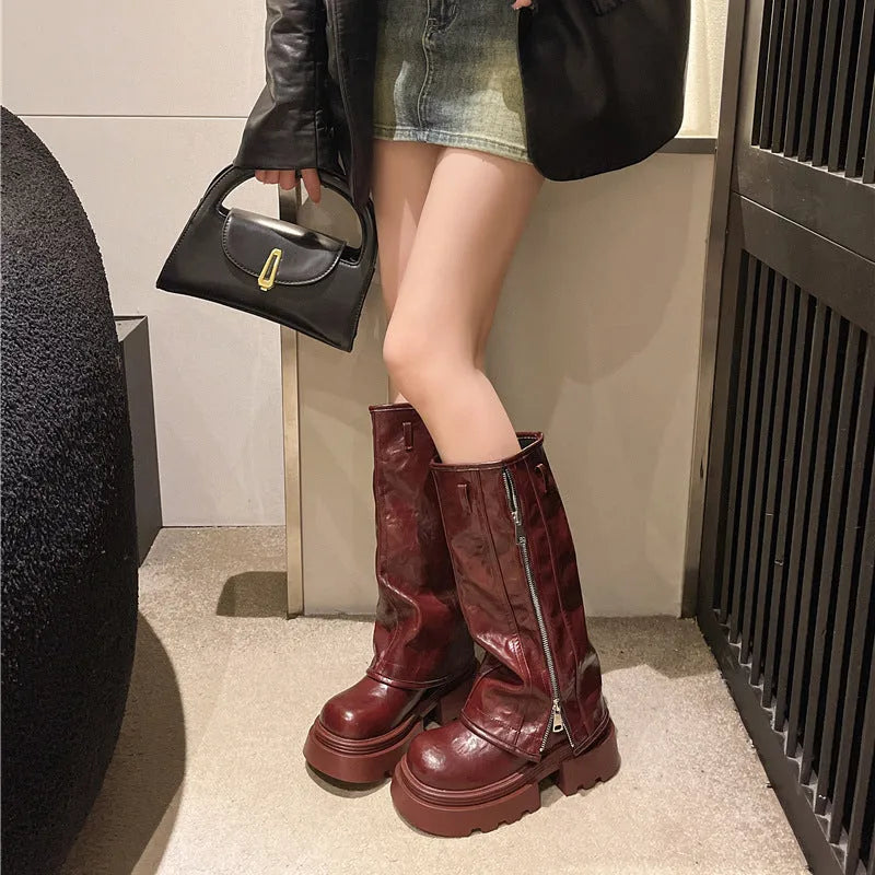 Black platform muffin pants Martin boots with high-cut sock and square rubber heel.