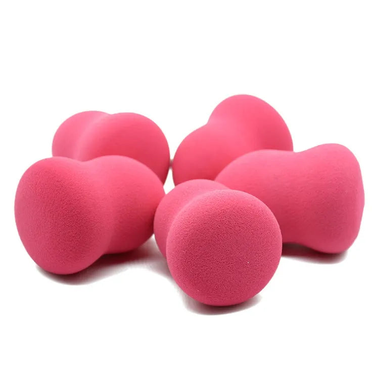 Pink makeup foundation sponge measuring 4cm by 4cm by 5.6cm with soft texture for wet or dry cosmetic application