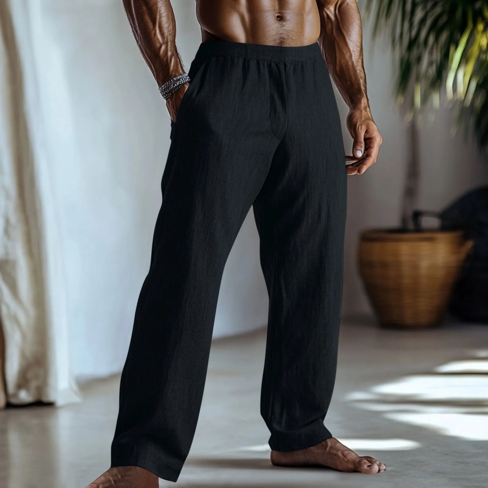 Straight leg cotton linen trousers in light green colour with visible front pockets on a plain background