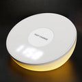 White wireless phone charger with LED clock display showing time, 115mm wide with three control buttons