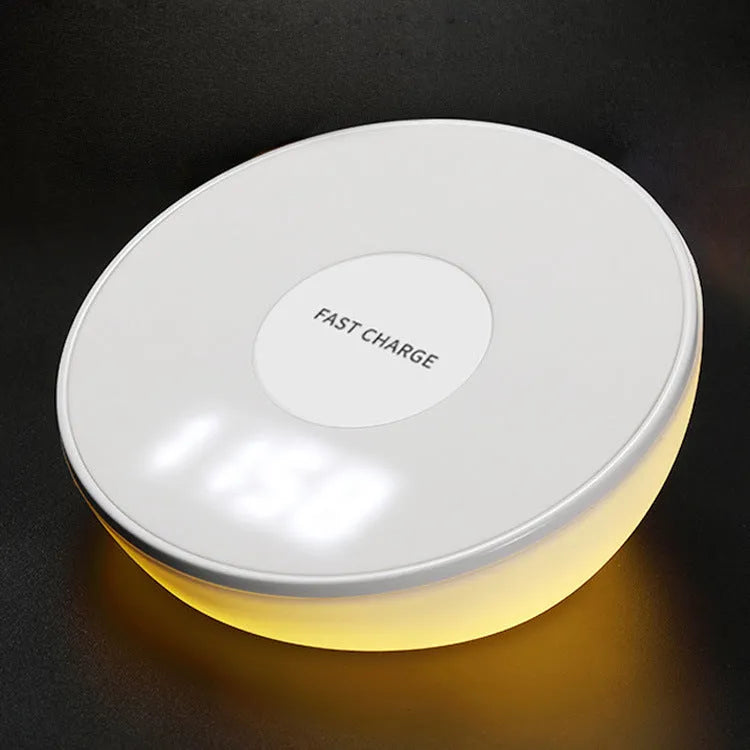 White wireless phone charger with LED clock display showing time, 115mm wide with three control buttons