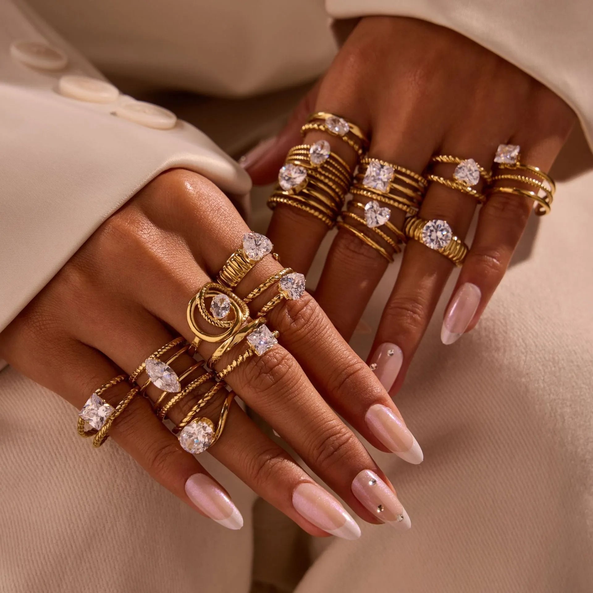 Gold-plated geometric stainless steel ring with inlaid zircon stones on a white background.