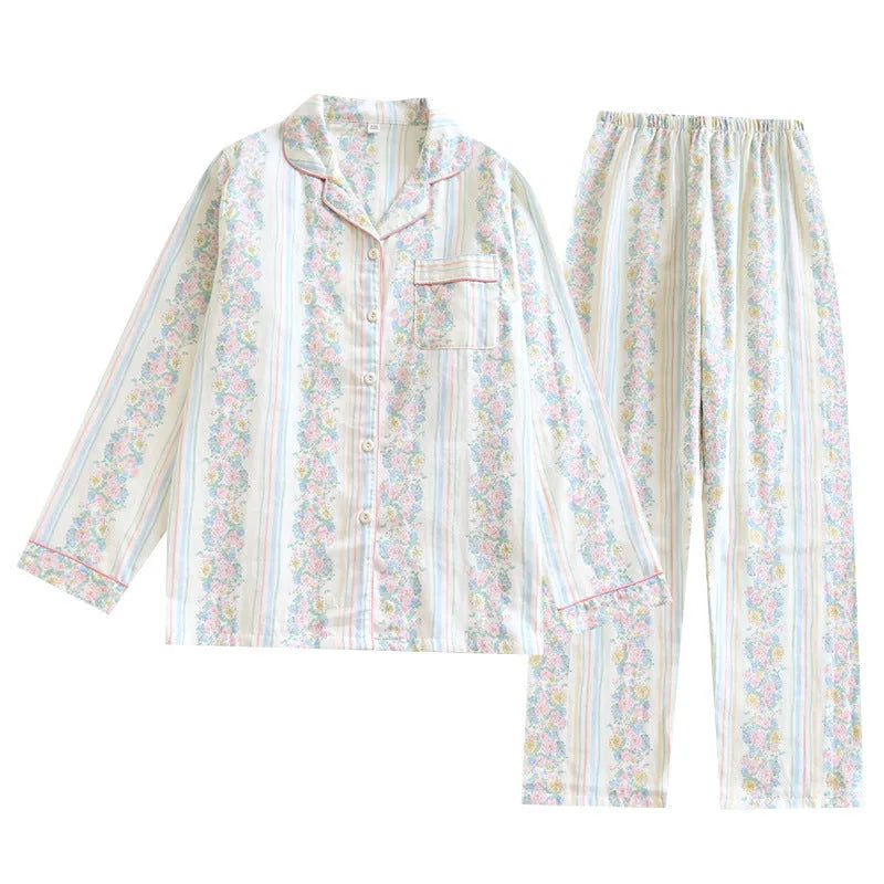 Ladies' red and white striped cotton gauze long-sleeved top and trousers loungewear set laid flat.