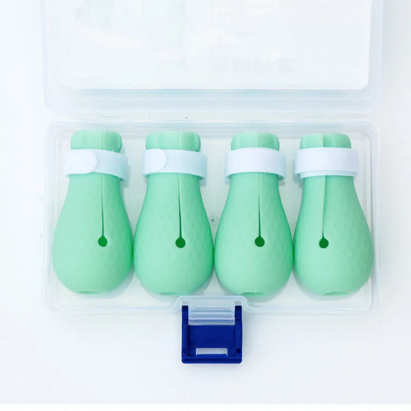 Set of four bright green silicone gloves for protecting hands from cat scratches during pet care.