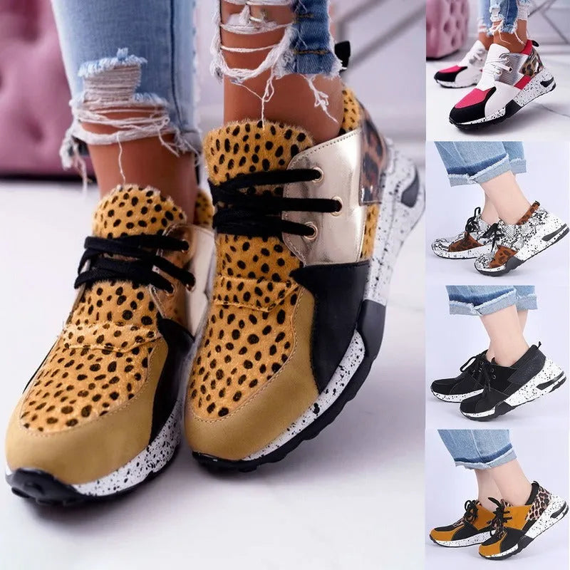 Women's black suede casual sneakers with a wedge heel on a white background