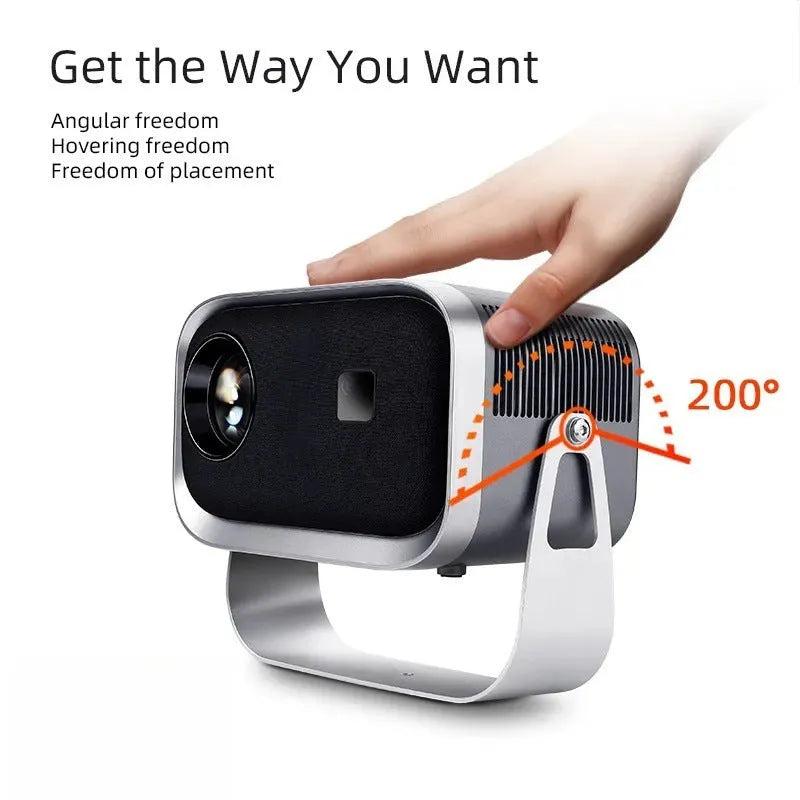 Portable 4K smart projector unit with remote on a wooden table