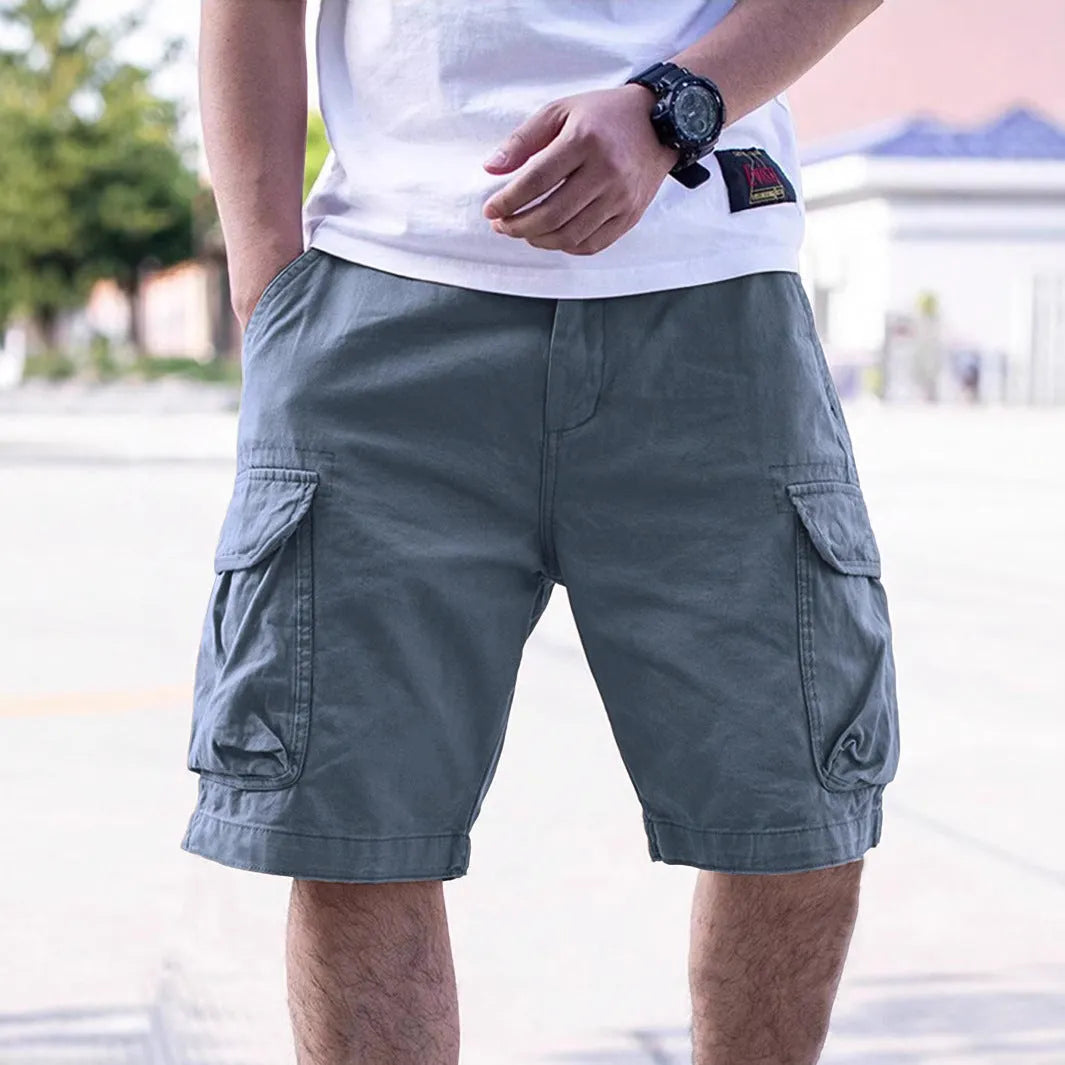 Men's loose fit cotton blend workwear shorts in army green on a mannequin