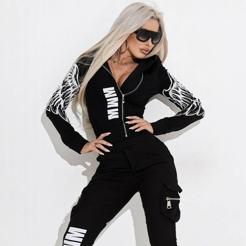 Black women's casual suit with hooded zip-up jacket and matching printed trousers on a hanger.