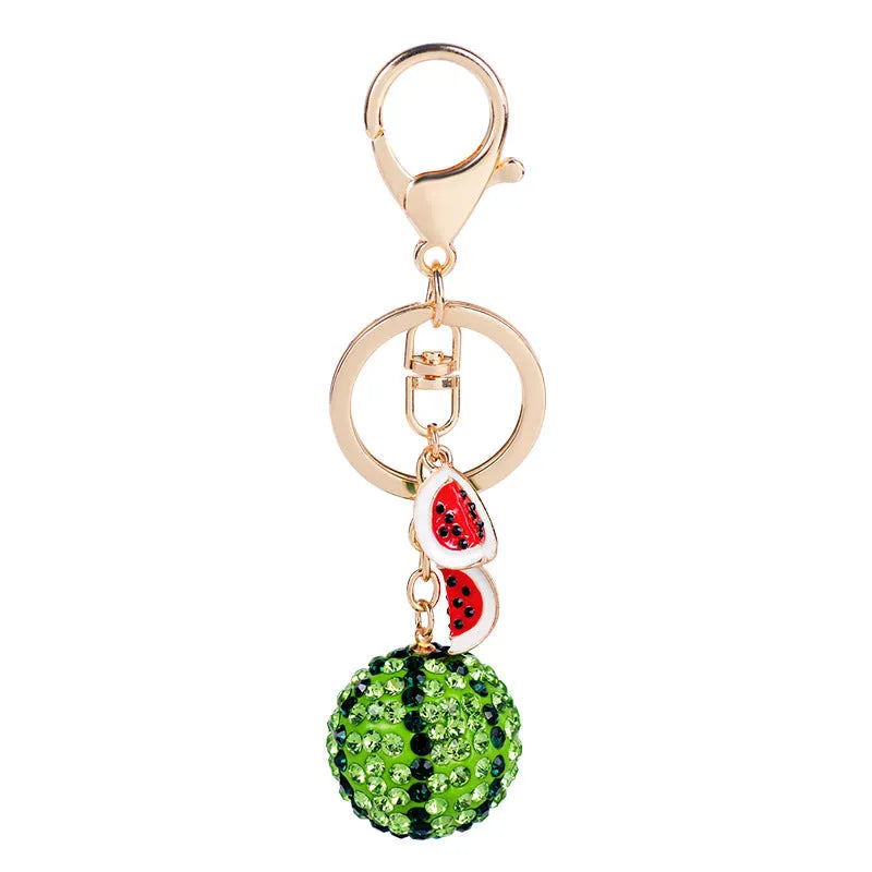 Green watermelon slice shaped zinc alloy keychain measuring 12cm long.