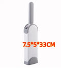 Blue reusable pet hair removal comb with double-sided brush head next to its self-cleaning base.