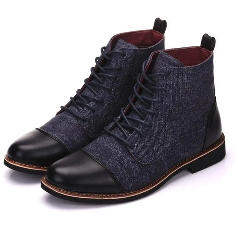 Men's black leather motorcycle boots with metal belt buckle details on a rubber sole.