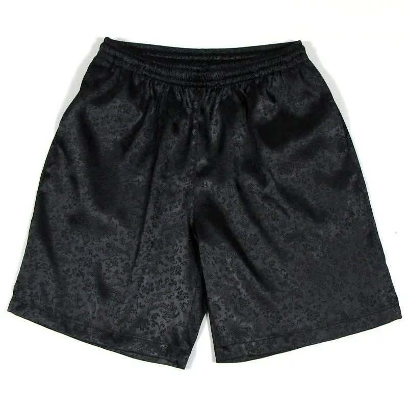 Men's traditional black Tang suit shorts with elasticated drawstring waistband laid flat