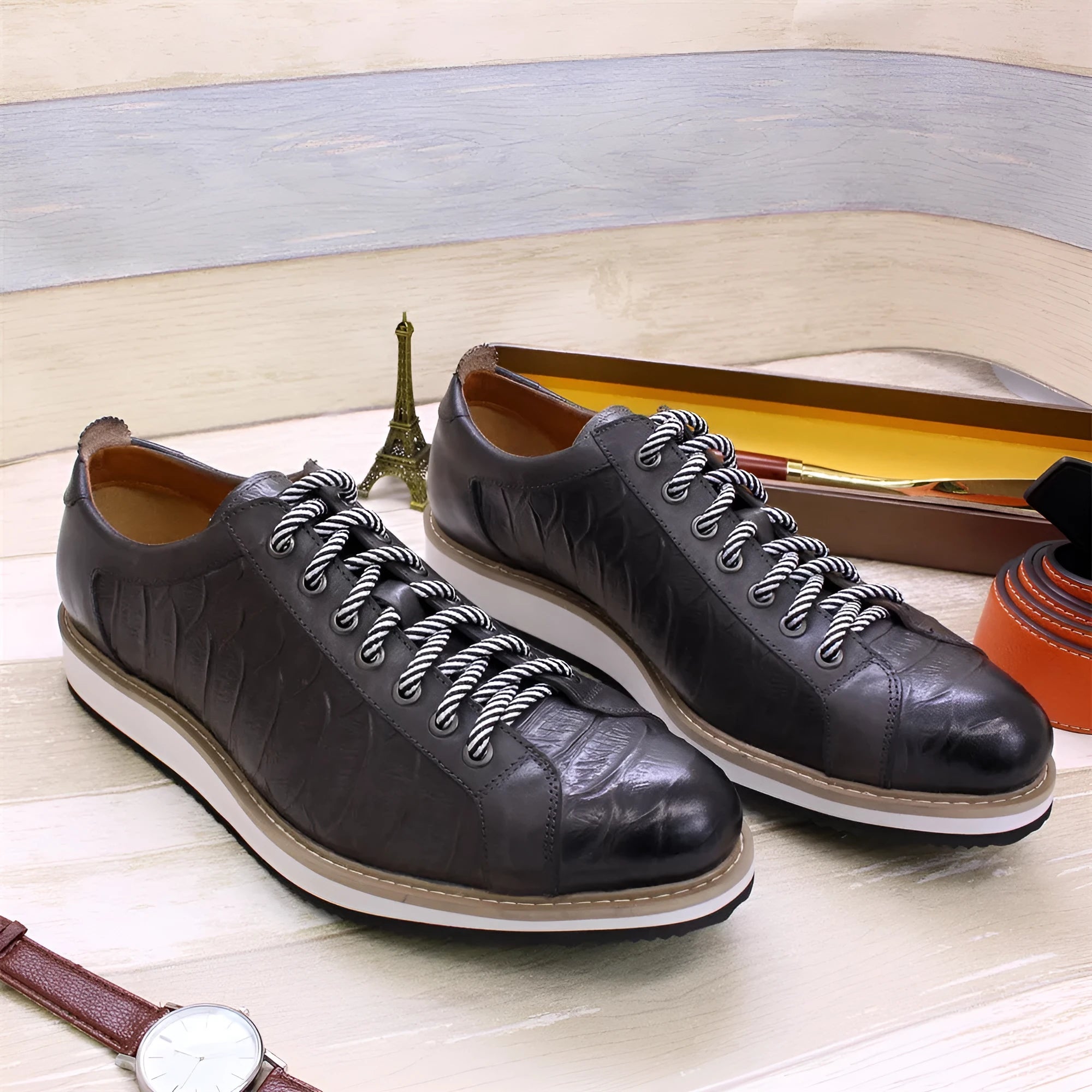 Men's low-top fashion shoes with an embossed pattern on the upper and front-tie laces.
