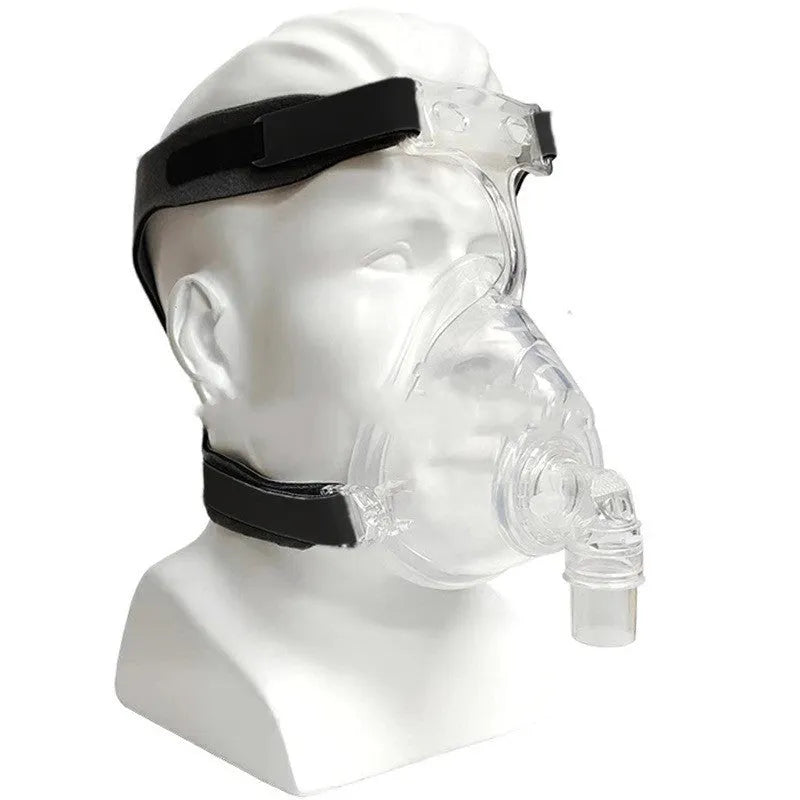 Transparent CPAP breathing mask with silicone cushion, headgear and two rotary elbows for ventilator connection
