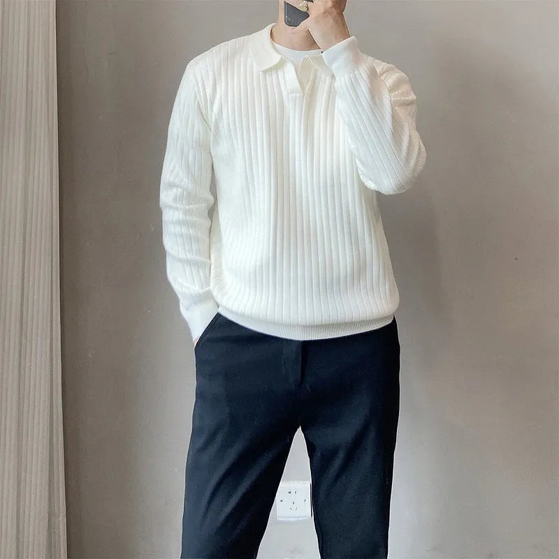 Man wearing a loose-fit Army Green knitted pullover sweater with long sleeves.