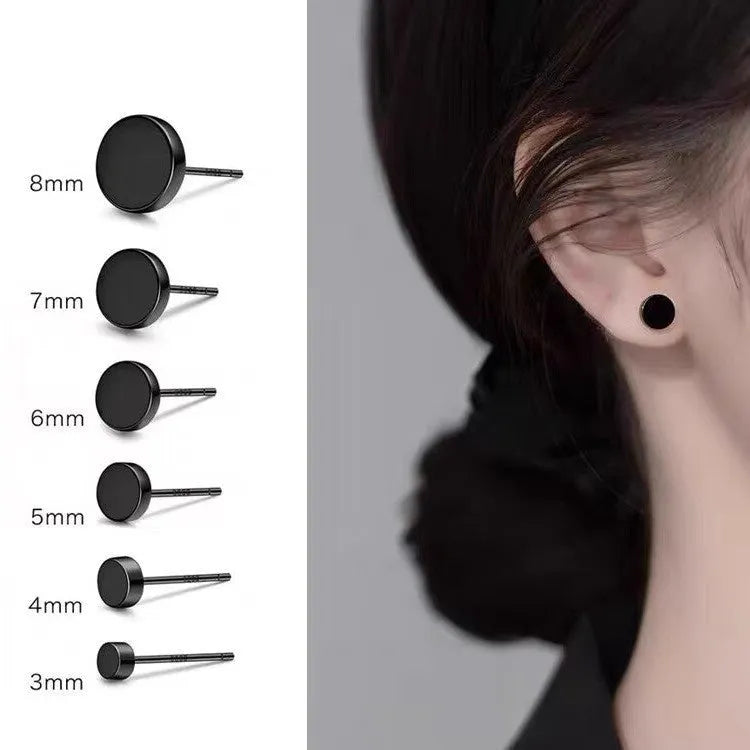A pair of S999 sterling silver round flat stud earrings on a plain background, showing silver and black colour options.