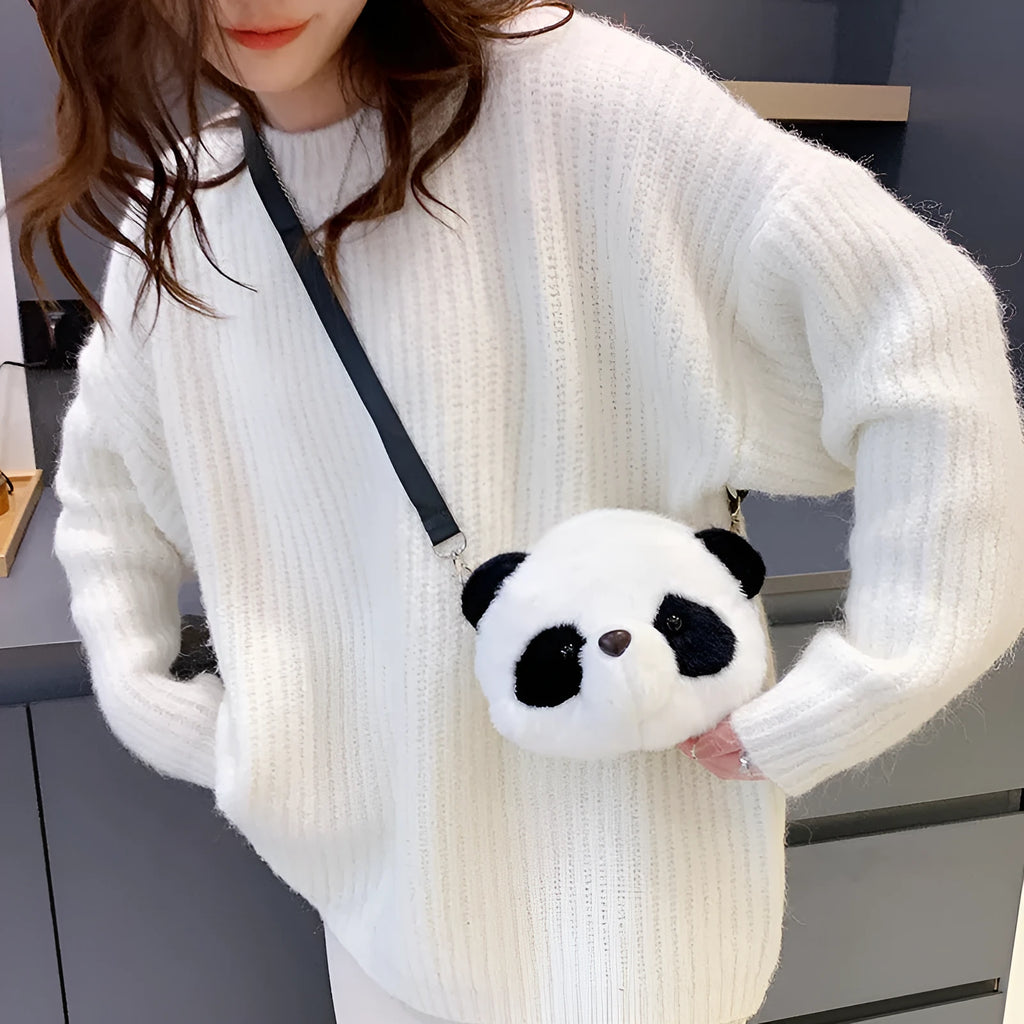 Cylindrical plush crossbody bag with panda head design showing outer sandwich pocket