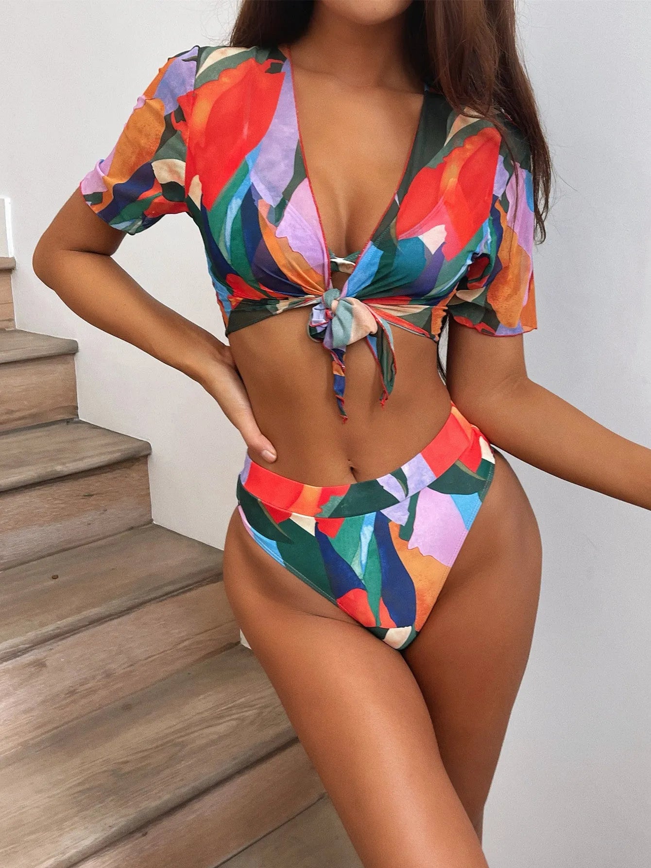 Red women's split swimsuit with printed design for swimming and surfing activities