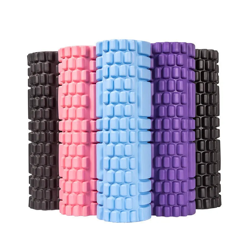 EVA foam roller in various colours including black, grey, pink, blue, and purple on fitness mat
