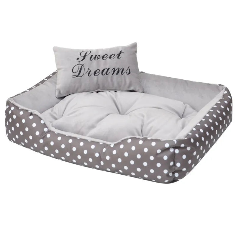 Polka dot printed square dog bed with a matching embroidery pillow in rose red, shown in a small size.