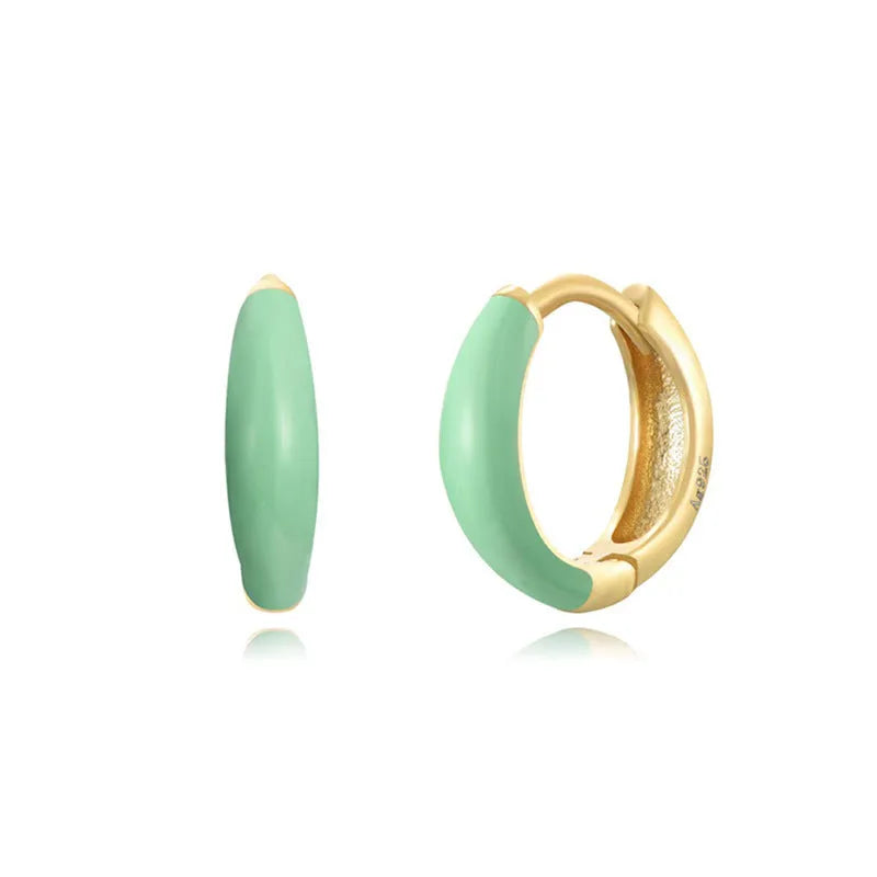 Geometric U-shaped epoxy earrings with a dripping oil finish in various colours.