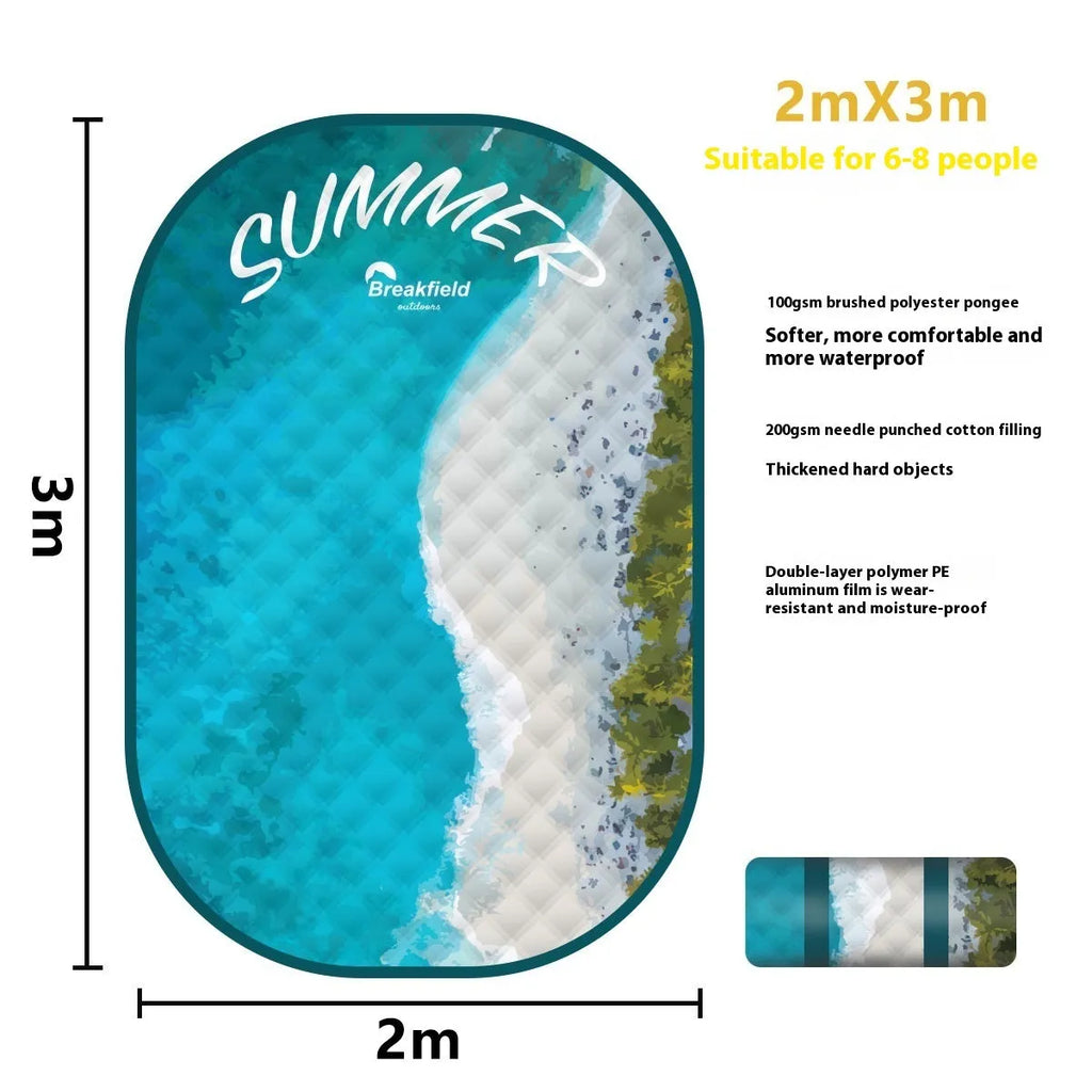 Waterproof thickened picnic mat in a Four Seasons colour, shown unrolled on grass.