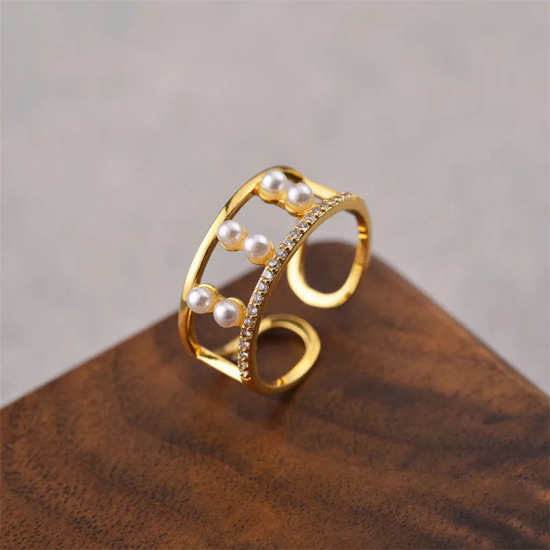 Geometric open women's ring in electroplated gold colour made from copper material