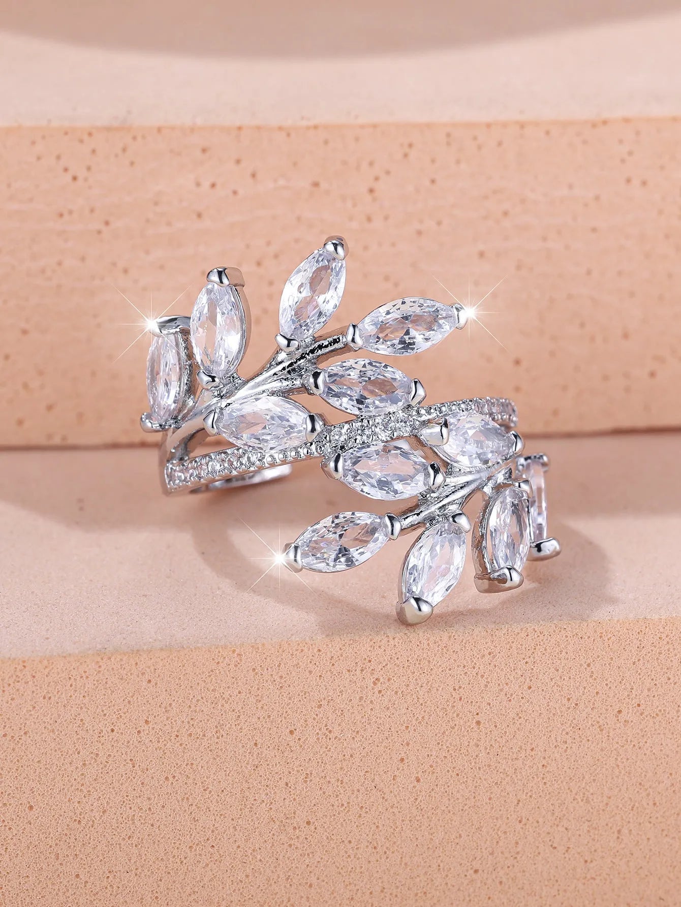 Adjustable copper leaf ring with a horse eye zircon stone in a choice of nine colour finishes.