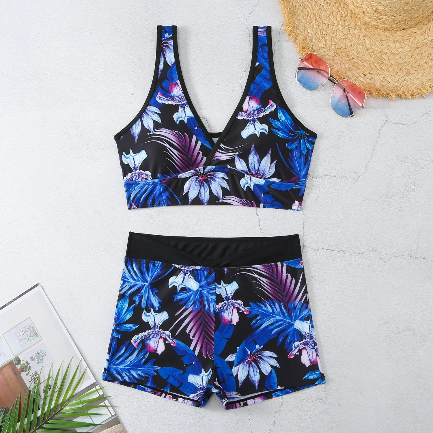 Women's two-piece printed swimsuit set with sleeveless top and boxer shorts in a multi-colour design.