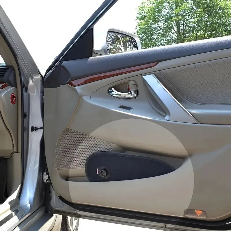 Black stretchy car side window sunshade for babies, shown with suction cups attached.