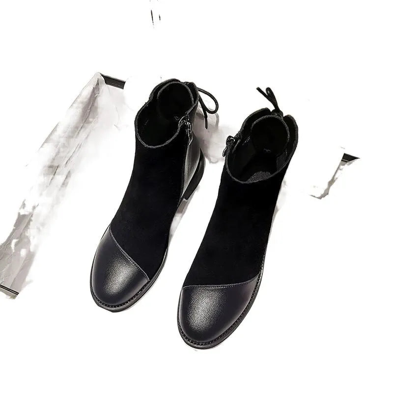 Women's black knee-high Martin boots with side zip and bow detail